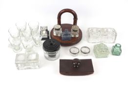 A collection of inkwells and an assortment of collectables.
