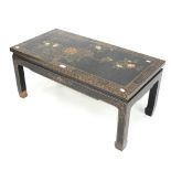 A Chinese lacquered coffee table.