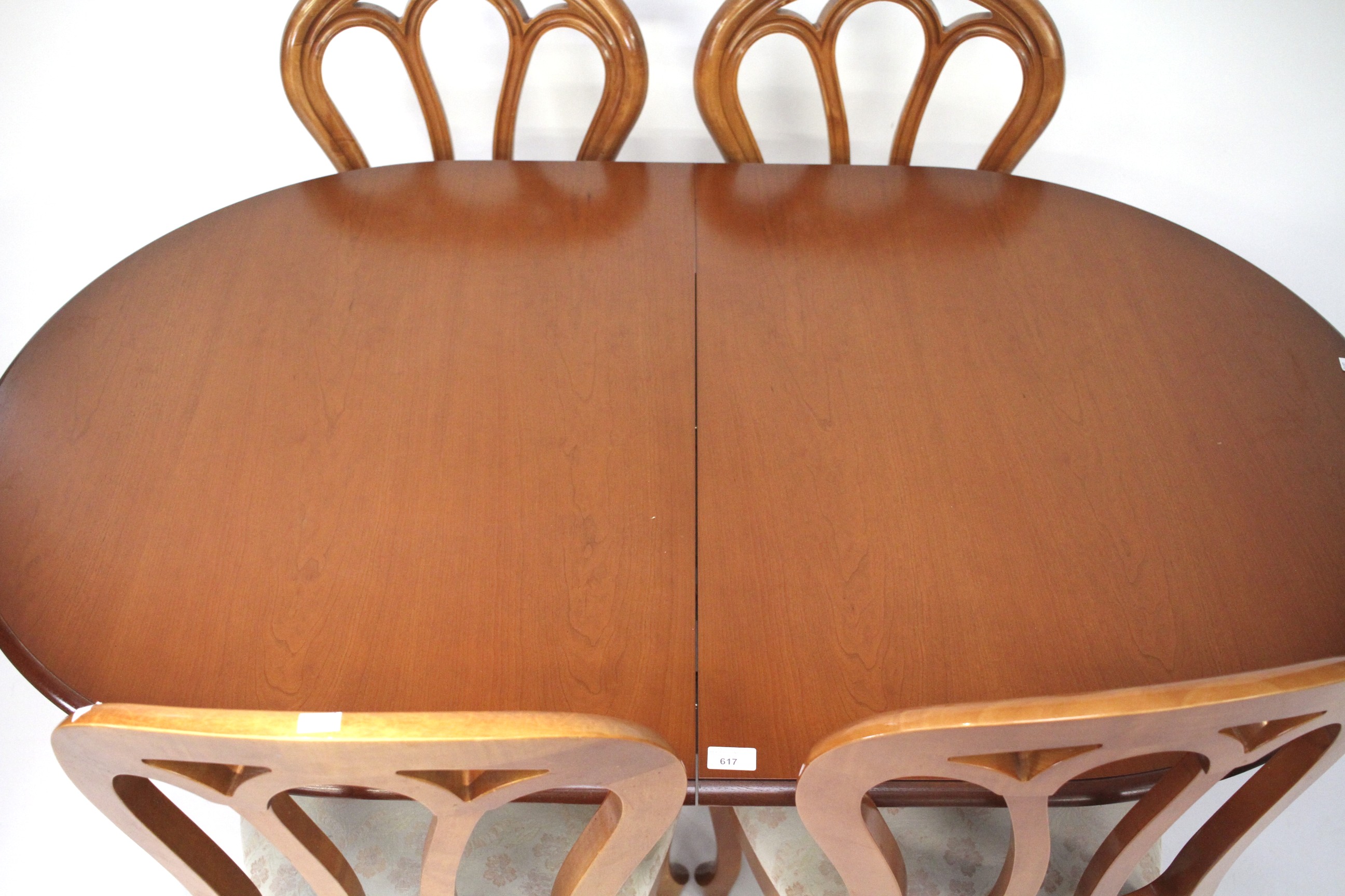 A contemporary wooden extendable dining table and four chairs. - Image 3 of 3