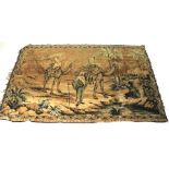 A silk rug/ wall hanging depicting a Far Eastern scene of travellers with camels.