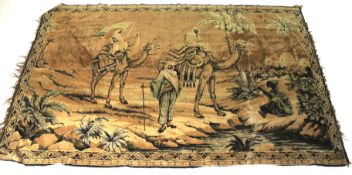 A silk rug/ wall hanging depicting a Far Eastern scene of travellers with camels.