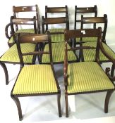 A set of eight mahogany Regency style dining chairs.
