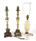 A pair of brass table lamps and a cream alabaster example.