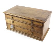 A 19th century table top three drawer cabinet. With graduated drawers and later handles, L48.