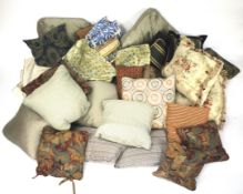 Three boxes of cushions of various sizes, colours and patterns.