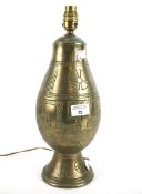 A stoneware gilt-bronze effect table lamp.