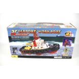 A battery operated 'RC Seaport Work Boat'.