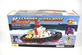 A battery operated 'RC Seaport Work Boat'.