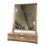 An early 19th century mahogany dressing table mirror.