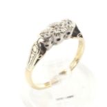 An 18ct gold and platinum set three stone diamond ring. Weight 1.