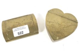 Two brass snuff boxes, both decorated with equestrian scenes. One a heart shaped example marked 'G.