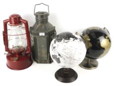 An oil lantern, an oil lamp and two globes.