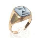 A 9ct gold signet ring. With a central blue stone in an Art Deco pattern, weight 6.