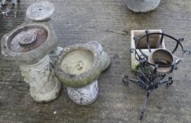 An assortment of garden ornaments and stands.