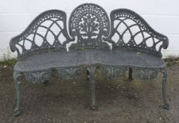 A cast metal three seat garden bench.