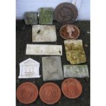 A collection of wall plaques.