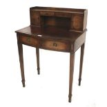 An early 20th century mahogany and rosewood veneered desk.