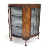 A walnut Art Deco style display cabinet.