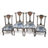 Four 19th century inlaid mahogany chairs.