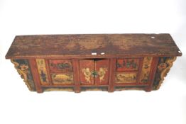 A 20th century wooden sideboard. Of oriental design.