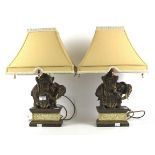 A pair of elephant lamps.