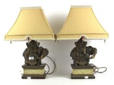 A pair of elephant lamps.