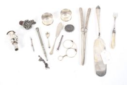 A box of assorted white metalware.