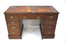 A 20th century mahogany twin pedestal writing desk.