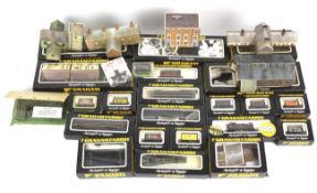 A box of assorted Graham Farish train accessories. Including buildings and boxed rolling stock.