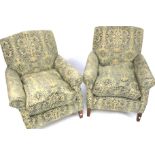 A pair of upholstered armchairs.