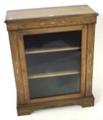 A Late Victorian marquetry display cabinet.