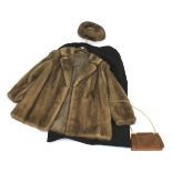 A mink fur coat, with matching hat and two bags.