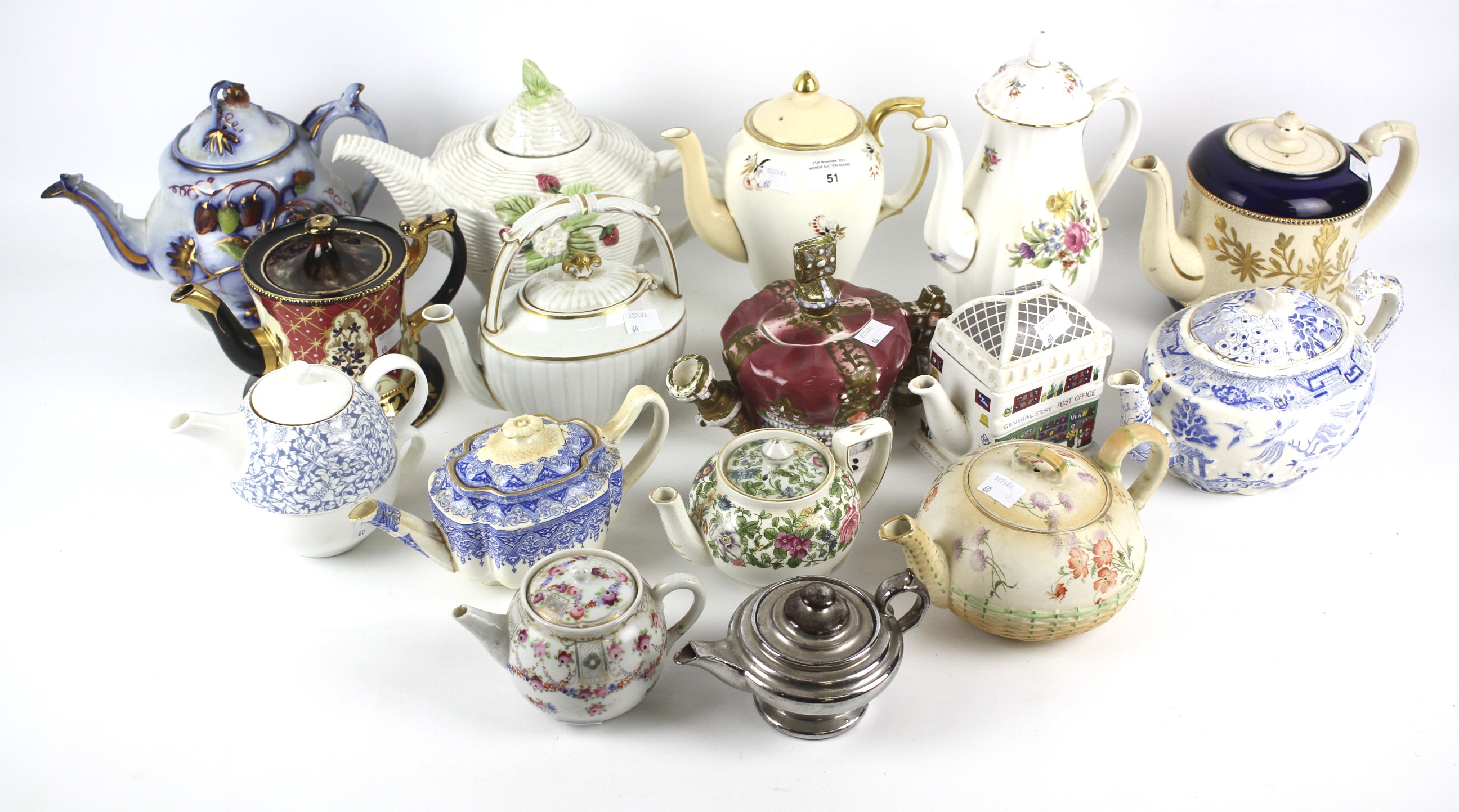 A collection of English pottery and porcelain tea and coffee pots,