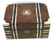 A Victorian rosewood and mother of pearl inlaid box.