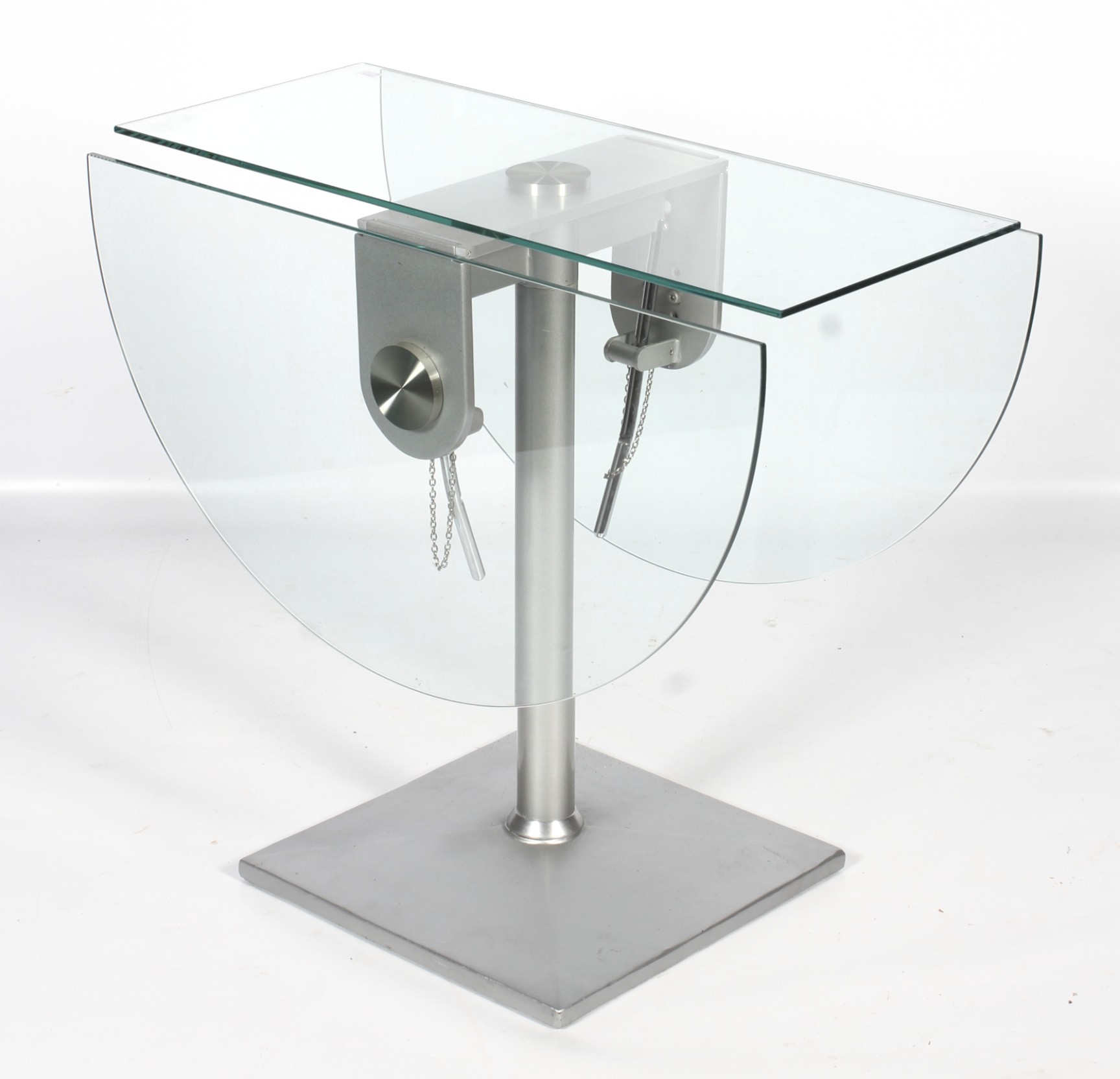 An oval glass drop leaf dining table. Raised on a turned metal column, on a square base, L124. - Image 2 of 2