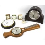 An assortment of clocks, barometers and travel clocks.