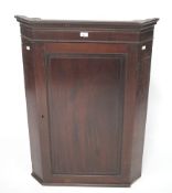 A Victorian mahogany corner cabinet.