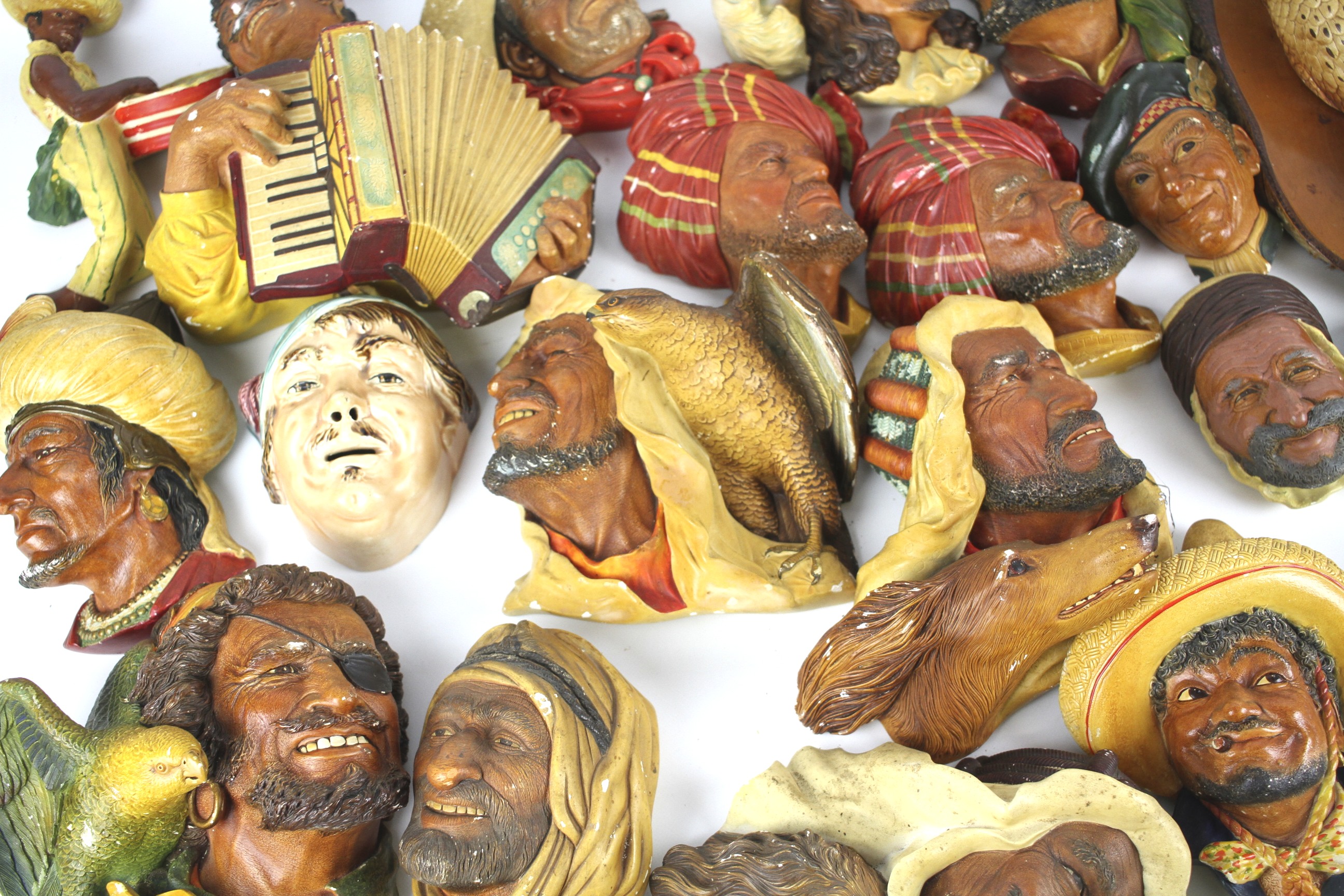 A collection of wall masks. - Image 3 of 3