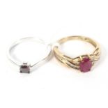 Two 9ct gold dress rings. Both set with red stones. Weight 4.