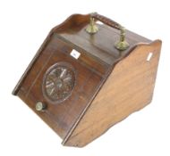 A Victorian mahogany coal scuttle.