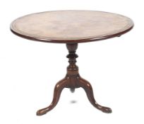 A Georgian mahogany circular tilt top occasional table.