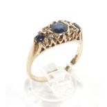 A 9ct gold three stone sapphire and diamond ring.