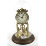 An early 20th century brass torsion clock.