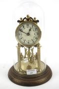 An early 20th century brass torsion clock.