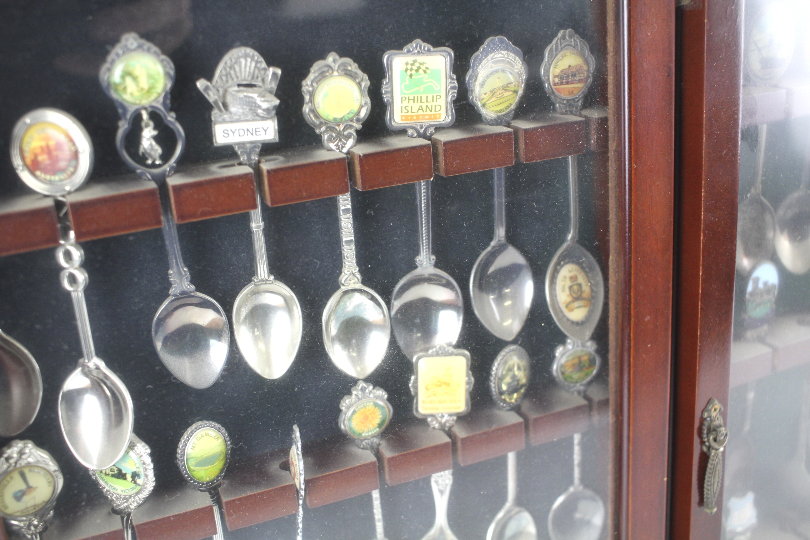 Three glazed wooden display cases containing a collection of souvenir spoons. - Image 2 of 2