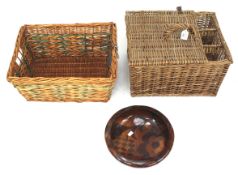 Two wicker baskets and a decorative wooden bowl.