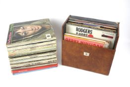 A large quantity of vintage vinyl records and albums.