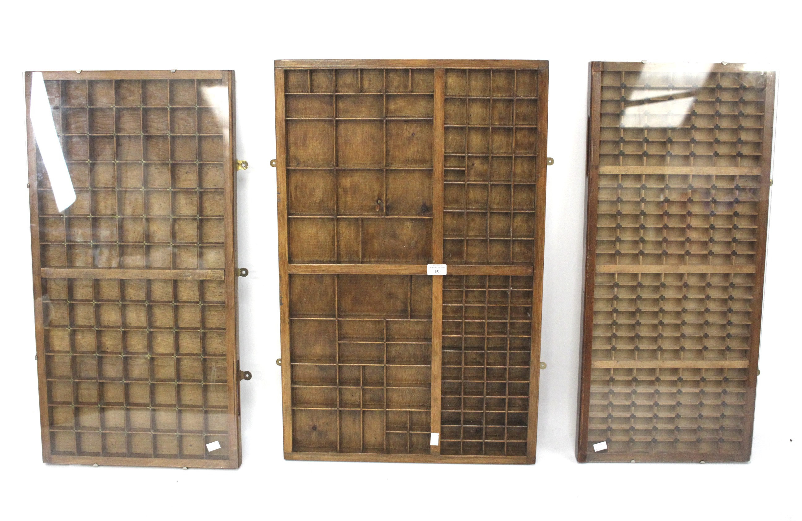 Three large wooded printing block display trays.