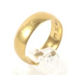 A 22ct yellow gold wedding band. Weight 5.