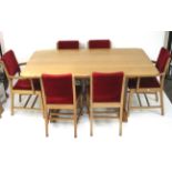 A 20th century hand crafted oak dining table and six chairs.